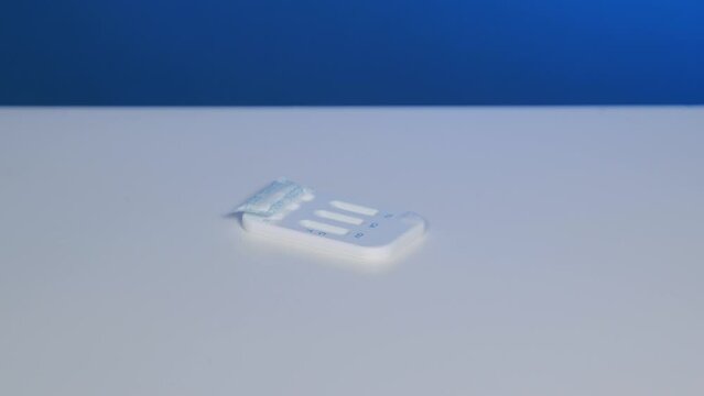 Rapid test device for self-testing for covid, hiv is put on white table