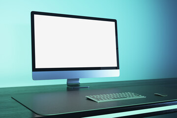 Contemporary blue workplace with empty white mock up computer monitor. Office concept. 3D Rendering.
