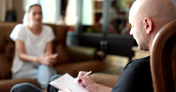 Woman explains a problem situation to psychologist at home. Mental health care