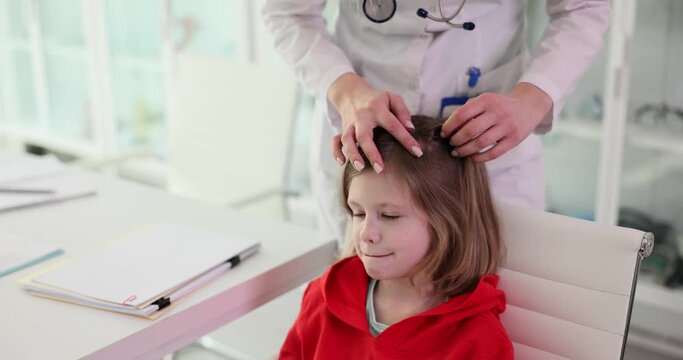 Checking Hair Of Child Of Girl With Long Hair By Doctor In Blade. Doctor Checks Child Hair For Head Lice And Possible Infestation With Lice