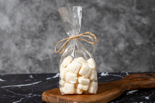 Milk candy. Packed hard milk flavored candy on a dark background. local name mevlana sekeri