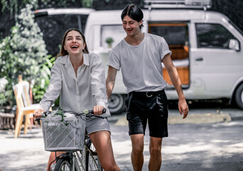 The soon-to-be life partners ride their bikes together. A young adult couple's romantic love, caring, and devotion. Long association and mutual understanding enhance the growth of a close relationship
