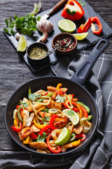 chicken fajitas with bell peppers, onion, spices