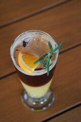 americano yuzu honey ice cool in glass cup on wooden table background, food, drink, object, cool, vintage, copy space