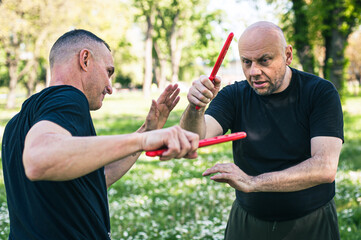 Knife vs knife fight combat training. Sumbrada training method. Plastic weapon defend demonstration...