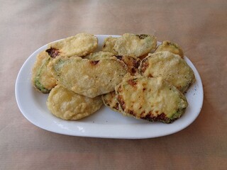 Fried zucchini slices served in a restaurant in Greece