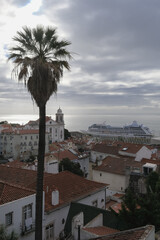Luxury liner cruiseship cruise ship Sirena, Regatta, Insignia or Nautica in port of Lisbon, Portugal during Mediterranean cruising with city skyline