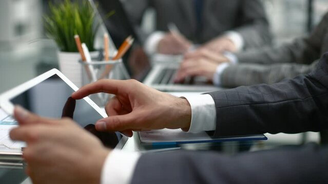 Business adviser analyzing financial figures denoting the progress in the work of the company