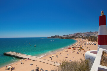 Albufeira beach aerial view (Praia do Peneco), Southern Portugal. Lighthouse on the beach
