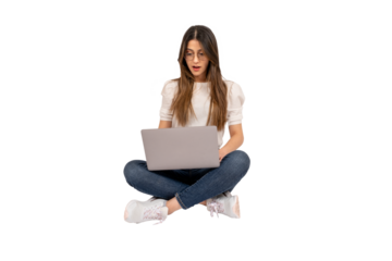 Shocked young woman, full body shot of shocked young woman. Sitting on the floor, using laptop. Lifestyle concept. Holding notebook. Surprised by what she saw on the social media. Copy space.