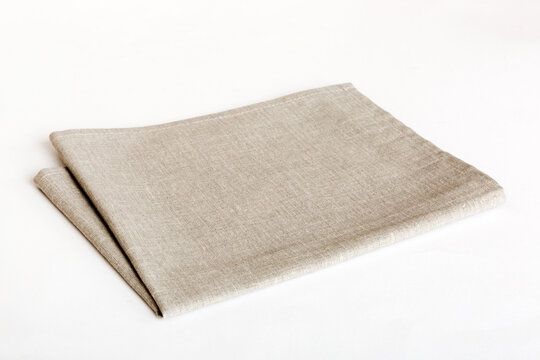 top view with gray kitchen napkin isolated on table background. Folded cloth for mockup with copy space, Flat lay. Minimal style