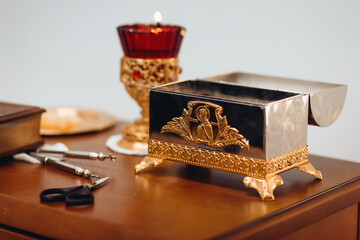 Infant Baptism. Accessories necessary for the ritual: icon, candles, cross