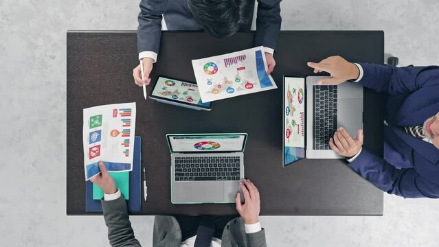 Group of people meeting in office. Directly above view.