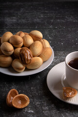 photo of condensed milk cookies and a cup of coffee