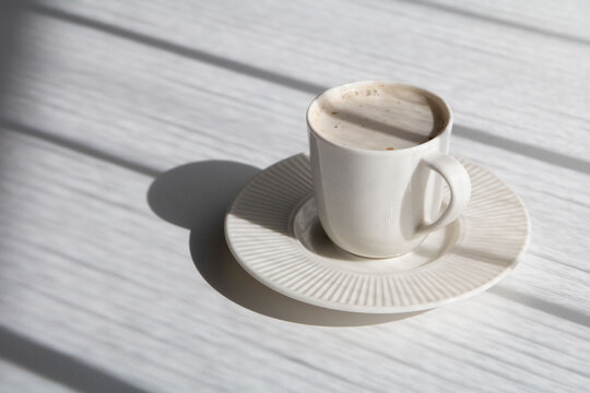 photo cup with coffee on a saucer