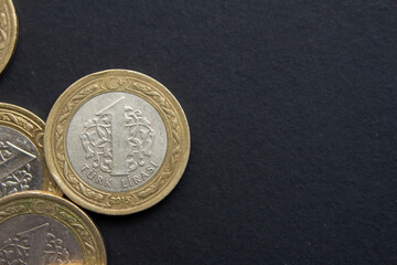 Turkish lira coins on black background. Closeup photo of Turkish coin moneys. - obrazy, fototapety, plakaty