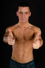 Fototapeta premium Young attractive man posing in the studio. 