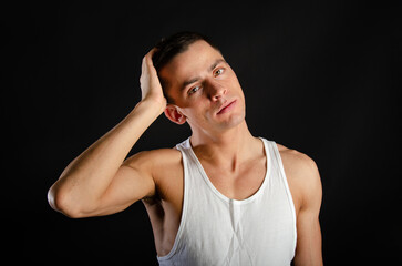 Young attractive man posing in the studio.	