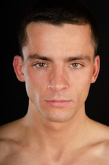 Obraz premium Young attractive man posing in the studio. 