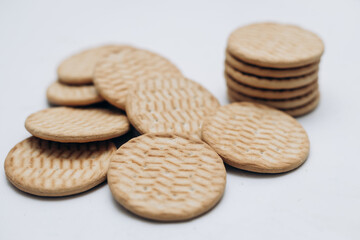 Cracker cookies lie on the table in a stack