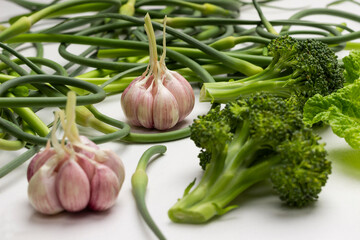 Heads of garlic and broccoli, garlic sprouts.