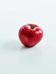 one red apple on white background