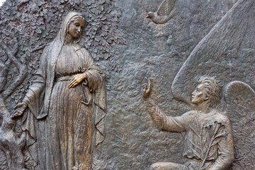 Fototapeta na wymiar The Annunciation of Our Lord – First Joyful Mystery on Mount Podbrdo in Medjugorje. Bronze relief hillside installations made by Carmelo Puzzolo. Medjugorje, Bosnia and Herzegovina. 2016/11/12. 