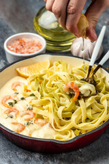 Pasta with Shrimp and bechamel sauce in a pan. Food recipe background. Close up