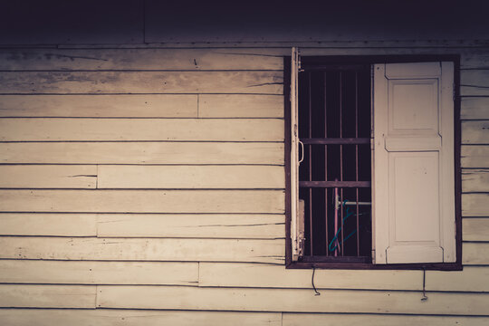 Old wooden wall with window