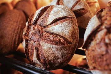 Vlies Fototapete Brot Organic Bakery - details of baker baking bread