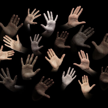 Freedom and humanity. Human hands, palms of different people of diverse gender, race and skin color appearing over black background. Human relation, community, togetherness, symbolism, culture concept