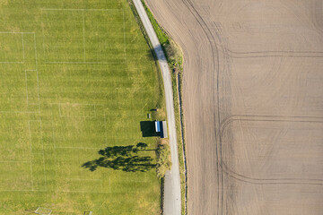 Aerial view of the fields, football pitch. Agriculture, sunny day. Amazing nature environment,...