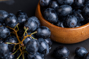 washed ripe black grapes covered with drops of water