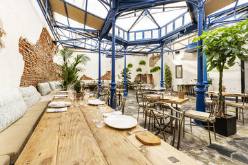 Nice hall of a restaurant with an old metal structure