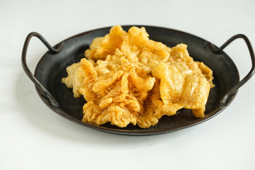 fried, ed fish belly yi piau, hu pio, usually made a soup with fish ball and vegetables