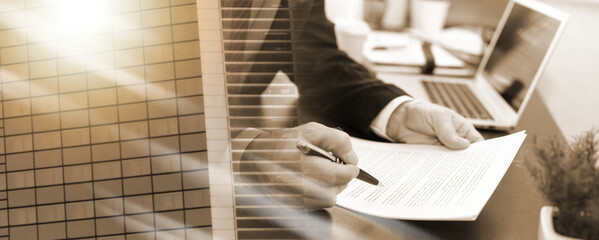 Businessman reading and checking document (lorem ipsum text used); multiple exposure