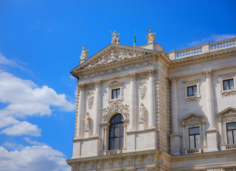 Fototapeta premium Vienna, Austria - August 27, 2022: The Hofburg in the imperial palace on Heldenplatz in the center of Vienna. Outside facade of historic and famous building. Concept for heritage building