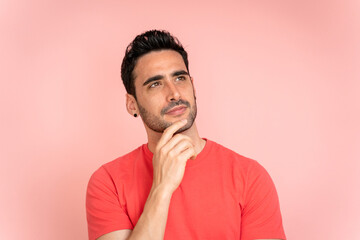 Thoughtful man looking away in studio shot.