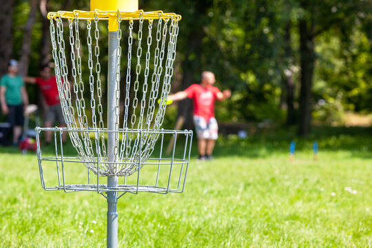 People playing flying disc golf sport game