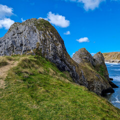 Fototapeta premium Three Cliffs Bay, a popular tourist destination located on the south coast of the Gower Peninsula in Wales.