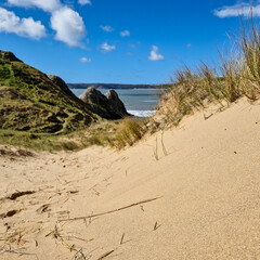 Three Cliffs Bay, a popular tourist destination located on the south coast of the Gower Peninsula in Wales.