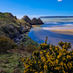 Fototapeta na wymiar Three Cliffs Bay, a popular tourist destination located on the south coast of the Gower Peninsula in Wales.