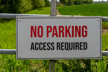 No parking access required sign on a gate to a field