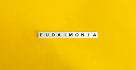 Eudaimonia or Eudaemonia (Good Spirit) Banner. Letter Tiles on Yellow Background. Minimal Aesthetics.