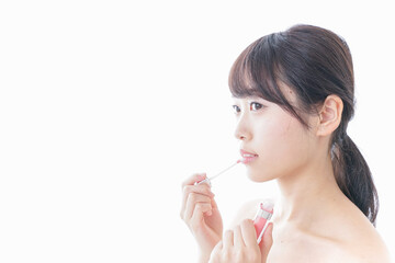 Naklejka premium お化粧をする女性