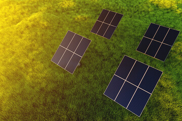 Solar panel modules at sunset in a field against a background of green grass. Ground power plant of alternative electricity