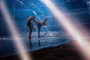 Martial arts of Muay Thai with Light and Shadow background,Thai Boxing, This photo can use for muay...