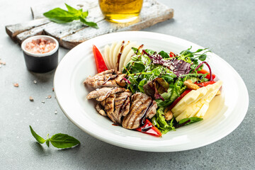 Healthy green salad with crispy fried meat and fresh vegetables. Concept healthy and balanced eating. place for text, top view