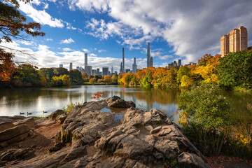 The Lake in Central Park with Billionaires Row skyscrapers. Autumn on Upper West Side, Manhattan, New York City