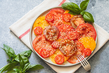 tomato salad with hemp seeds. healthy food concept with superfoods